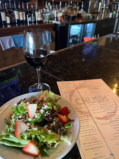 A menu and table setting at Crush